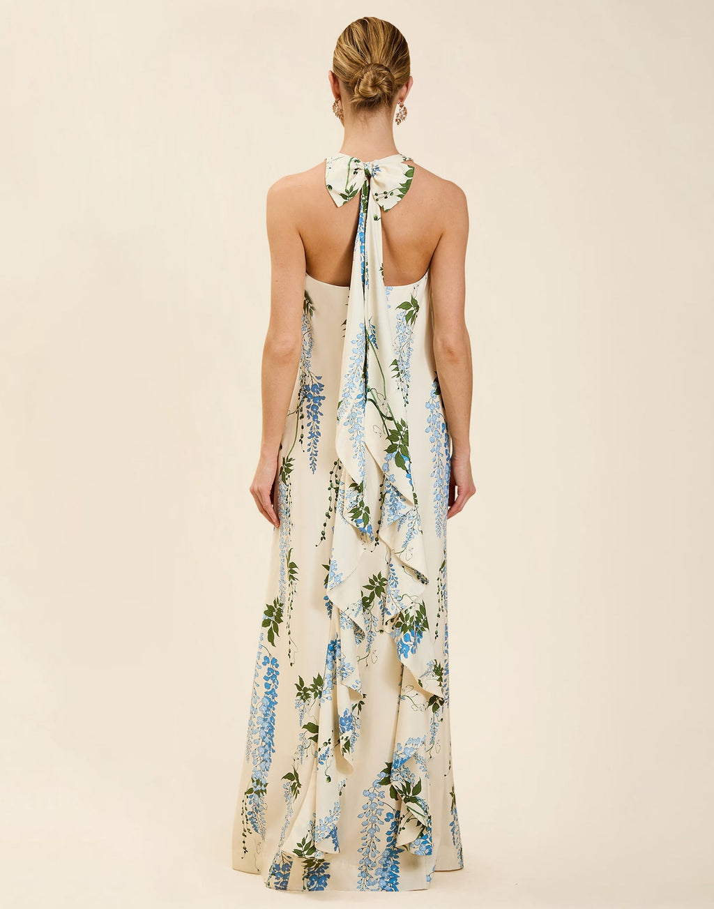 Adelina Gown in Wisteria Toile stretch crepe with halter neckline, cascading bow back detail, A-line silhouette, and hidden side pockets.
