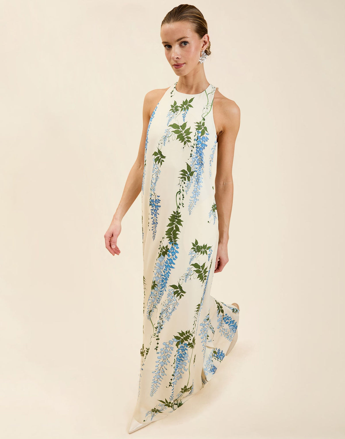 Adelina Gown in Wisteria Toile stretch crepe with halter neckline, cascading bow back detail, A-line silhouette, and hidden side pockets.