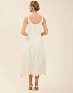 Amanda Midi Dress in Ivory moiré with tonal floral embroidery, scoop neckline, sleeveless bodice, and elegant A-line midi silhouette.