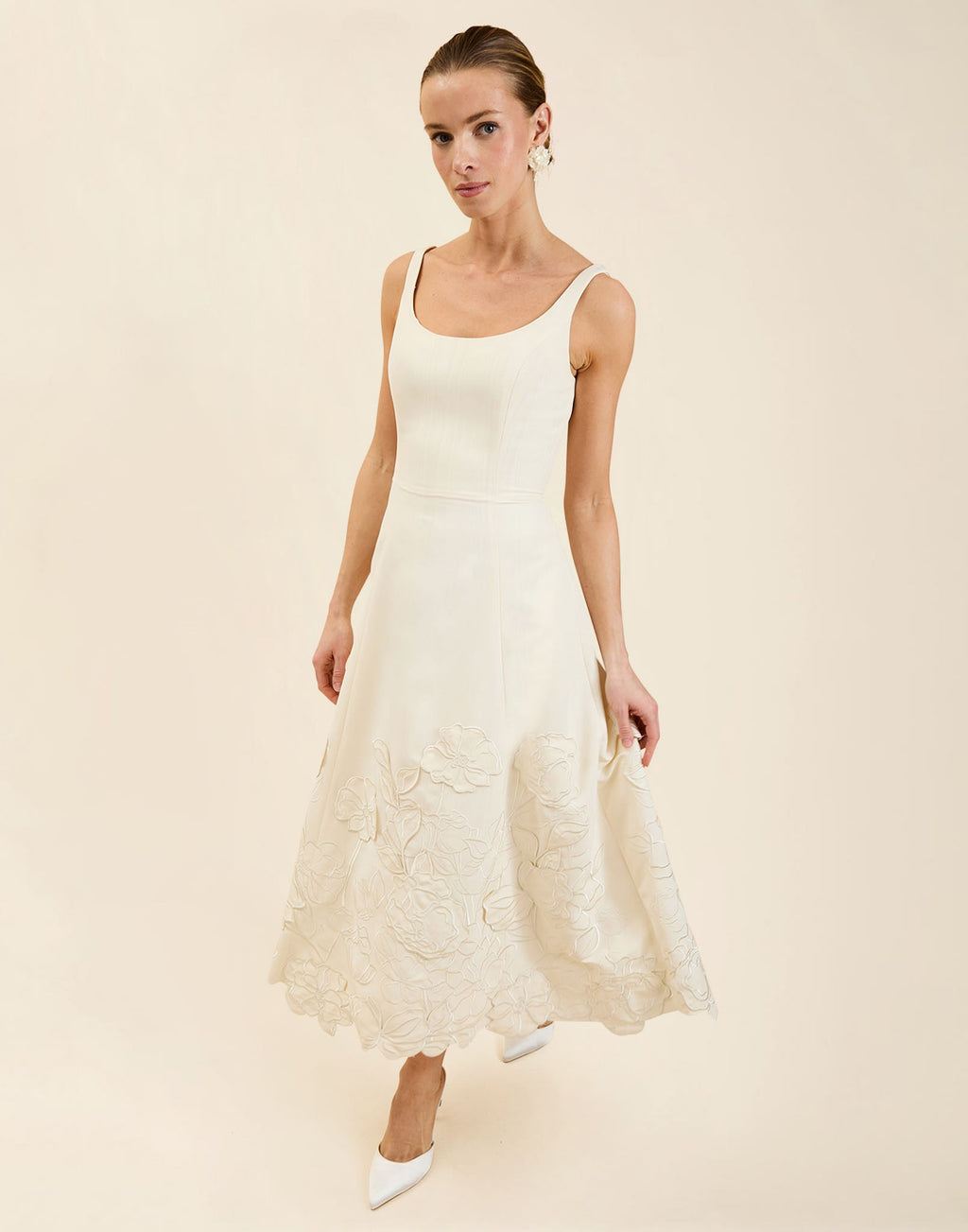 Amanda Midi Dress in Ivory moiré with tonal floral embroidery, scoop neckline, sleeveless bodice, and elegant A-line midi silhouette.