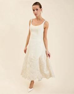 Amanda Midi Dress in Ivory moiré with tonal floral embroidery, scoop neckline, sleeveless bodice, and elegant A-line midi silhouette.