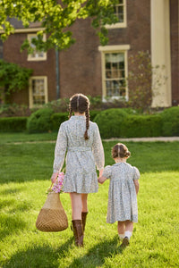 Little English traditional children's clothing. Capped sleeve blue, brown, and cream floral smocked dress with peter pan collar for little girls.