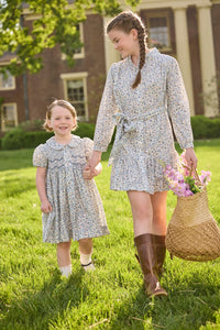 Little English traditional children's clothing. Long sleeve blue, brown, and cream floral shirt dress with tie sash for older girls.