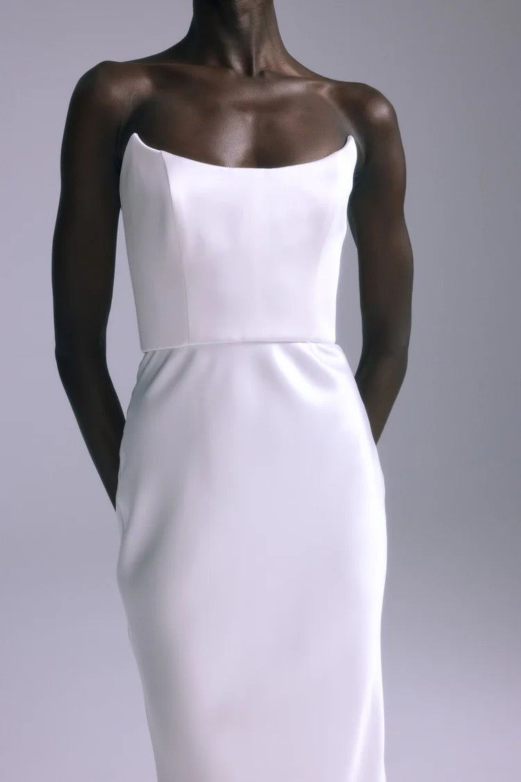 Front view of Haiku Gown silk-white satin gown with pointed bodice and slim fit, worn by model against light gray background