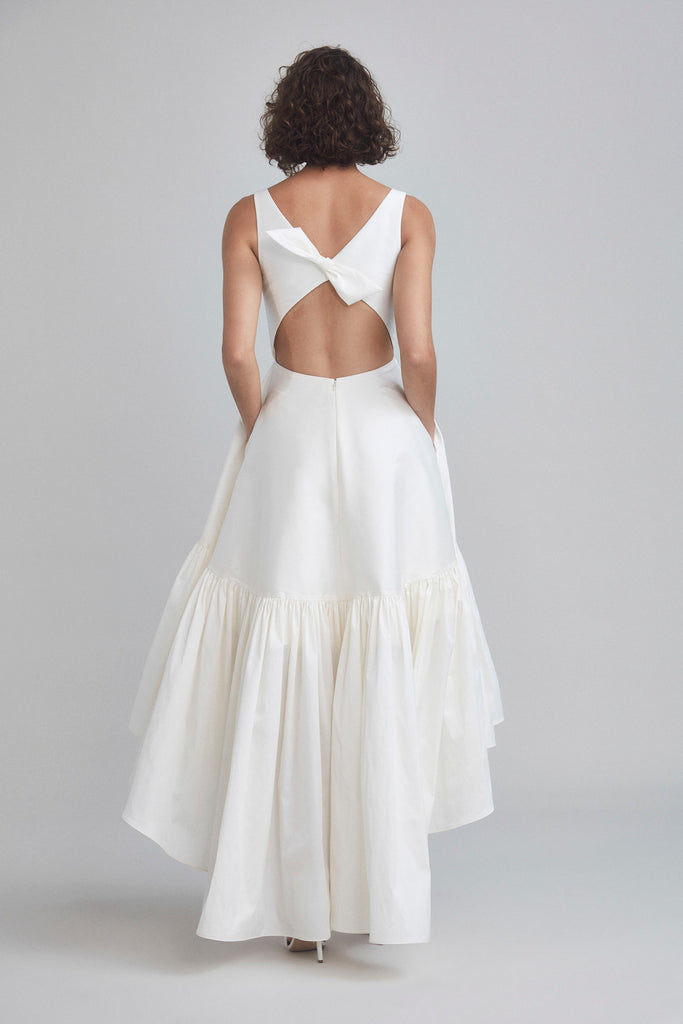 White ruffle high low dress top