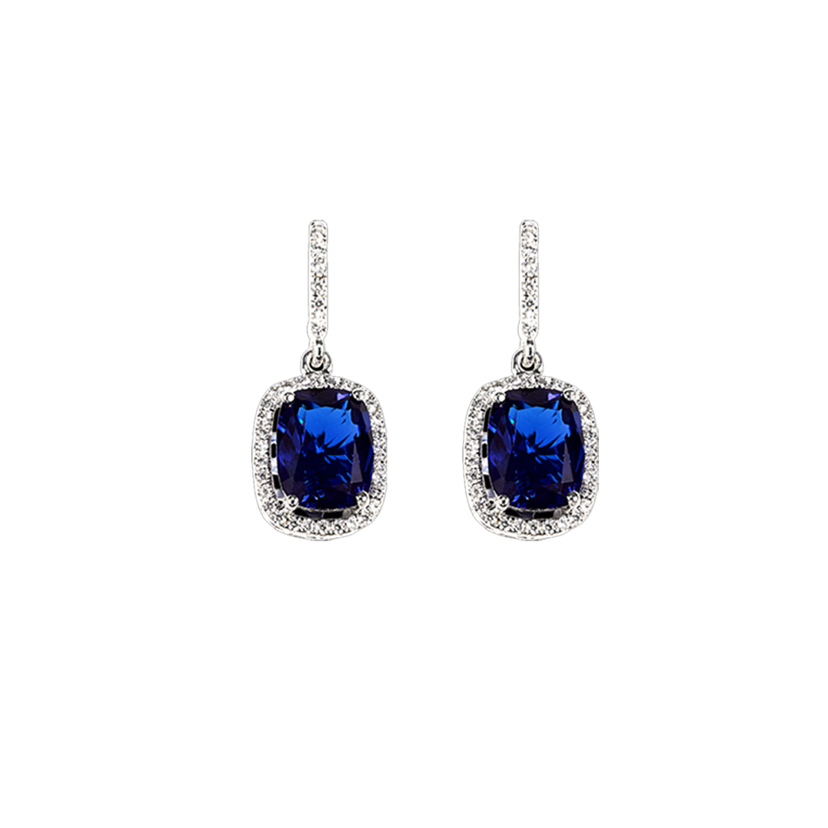 Front view of Comet Sapphire Earrings showcasing royal blue sapphires and diamond surrounds on a white background