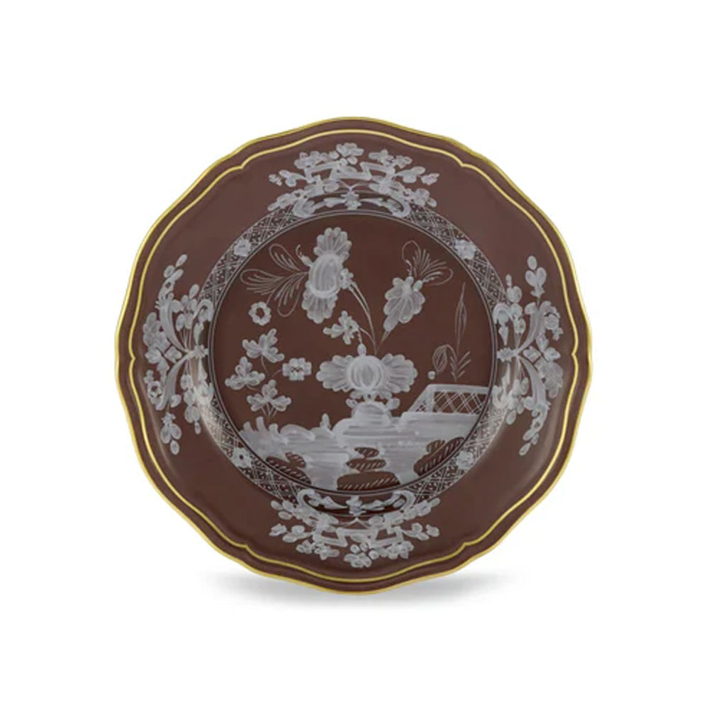 Top view of Oriente Italiano Antico Doccia Flat Bread Plate in Castagna with white floral motifs, scenic center, and gold rim