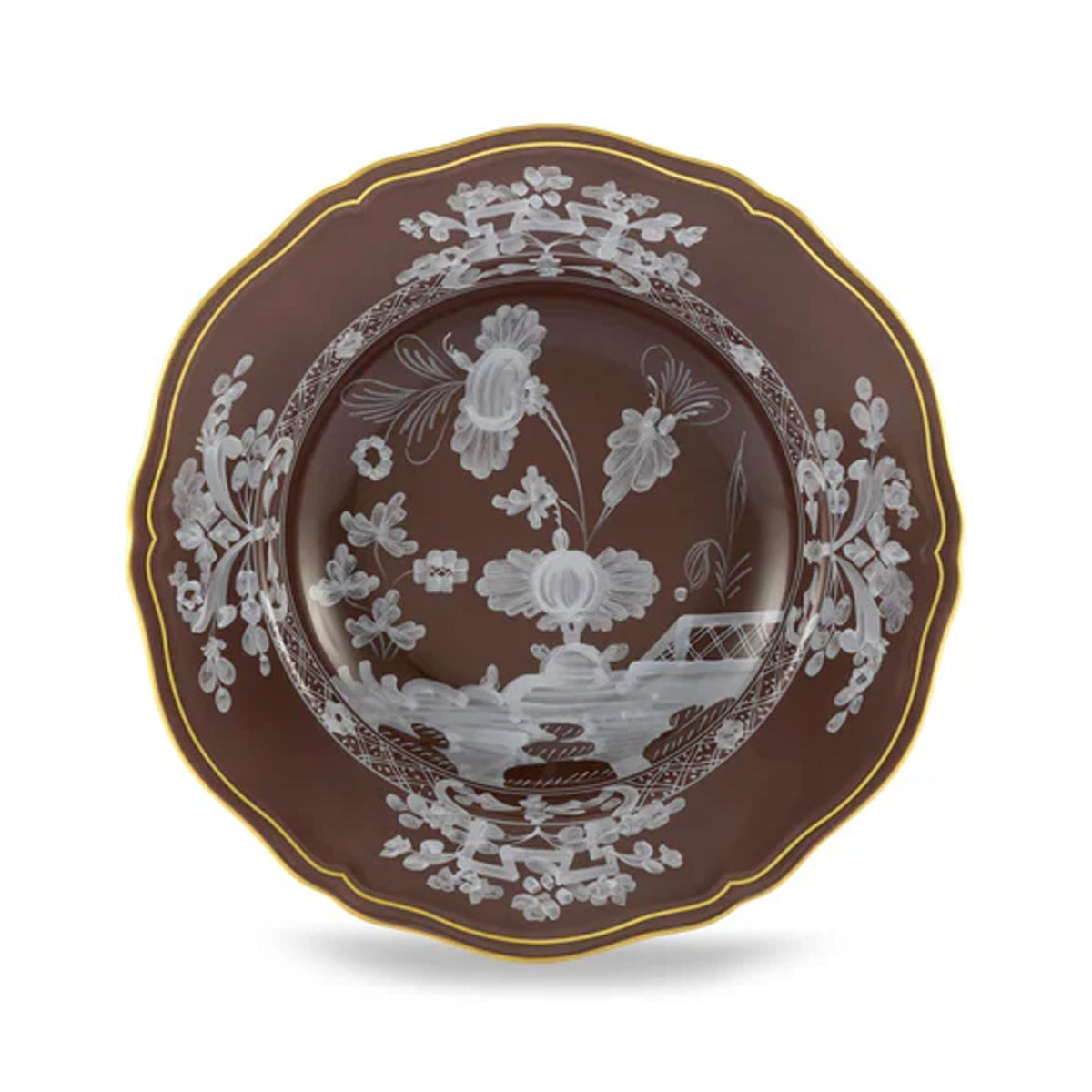 Top view of Oriente Italiano Antico Doccia soup plate in Castagna with floral motifs and scalloped gold rim on white