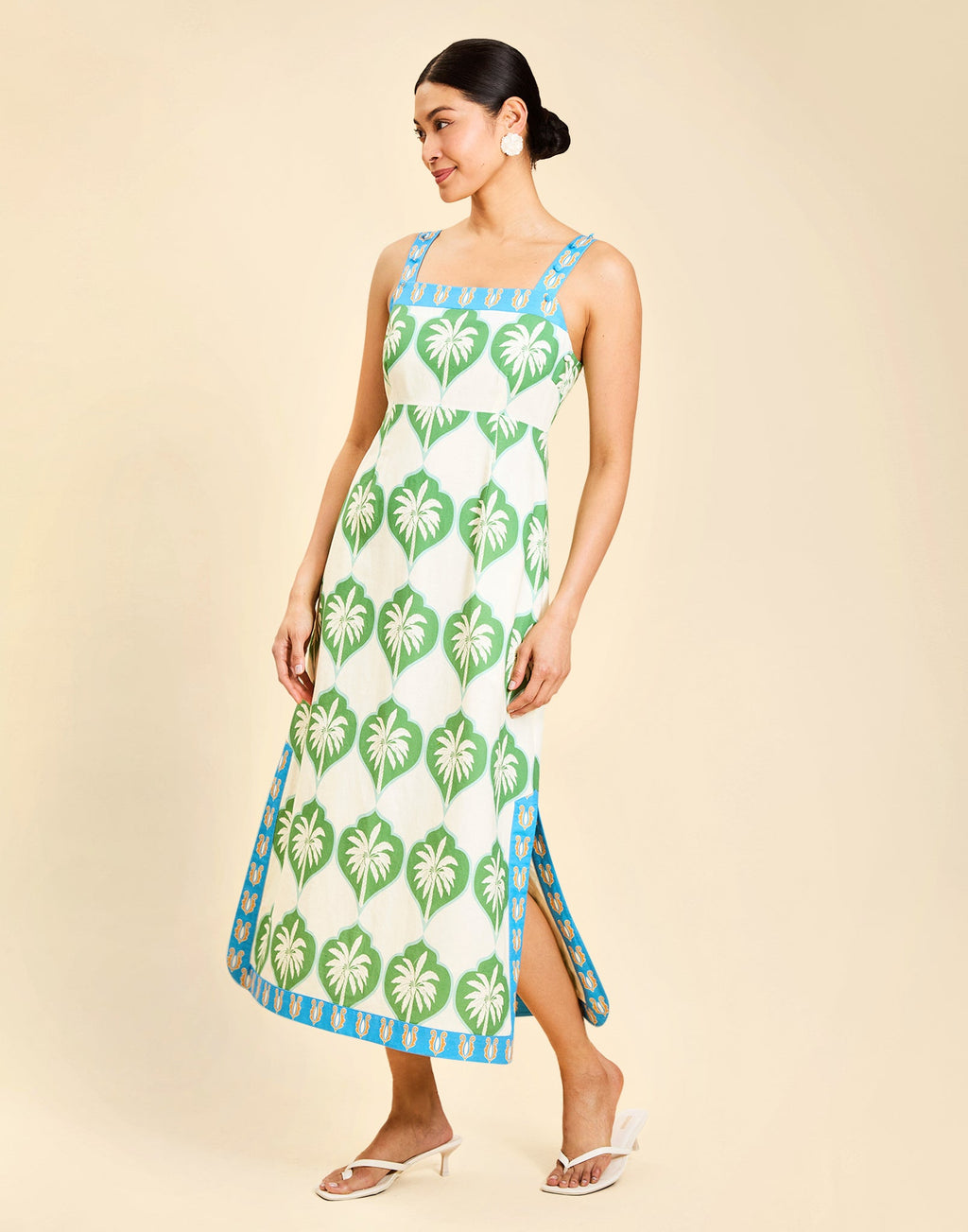 Apollo Convertible Midi Dress in Palm Bay Blue linen with square neckline, removable sleeves, and empire waist silhouette.