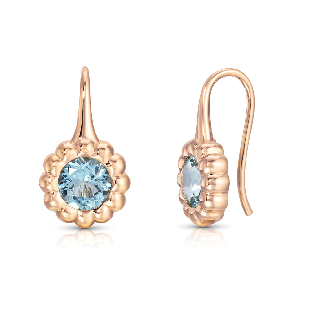Front and side of Aquamarine Reverie drop earrings with round aquamarine in fluted 14k rose gold bezel on white background