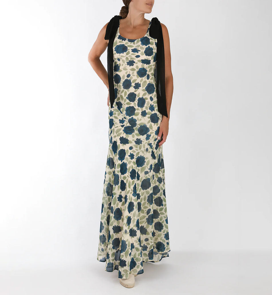 Front view of Sydney Dress with Midnight Bouquet print, fitted bodice, flared maxi skirt, and black ribbon shoulder bows