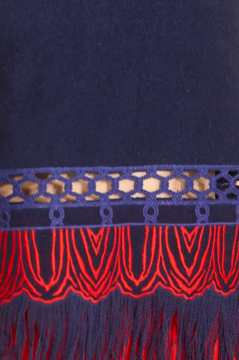 The Rivington Skirt is a midi in embroidered fringe wool, a clean finished waist and back zipper