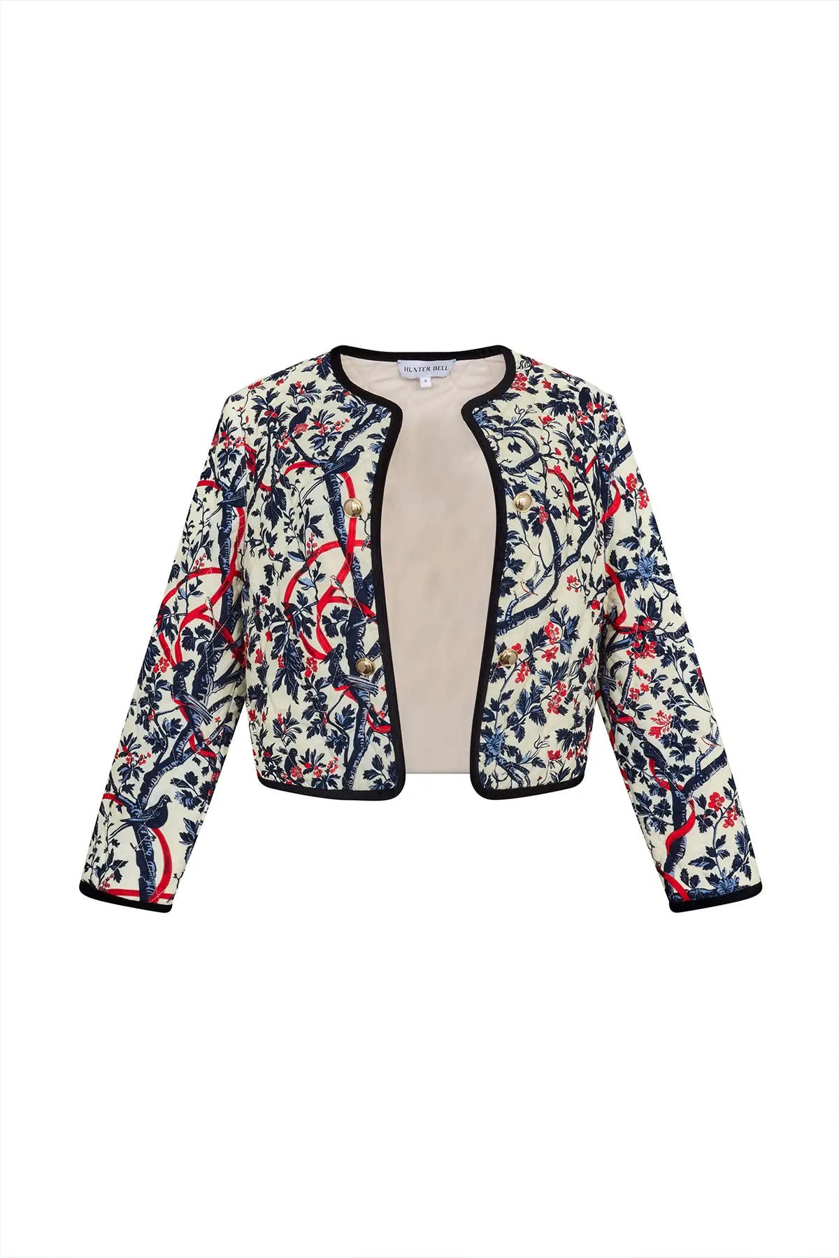 The Atwood Jacket is a quilted jacket with a crew neckline, long sleeves, and velvet ribbon trim.