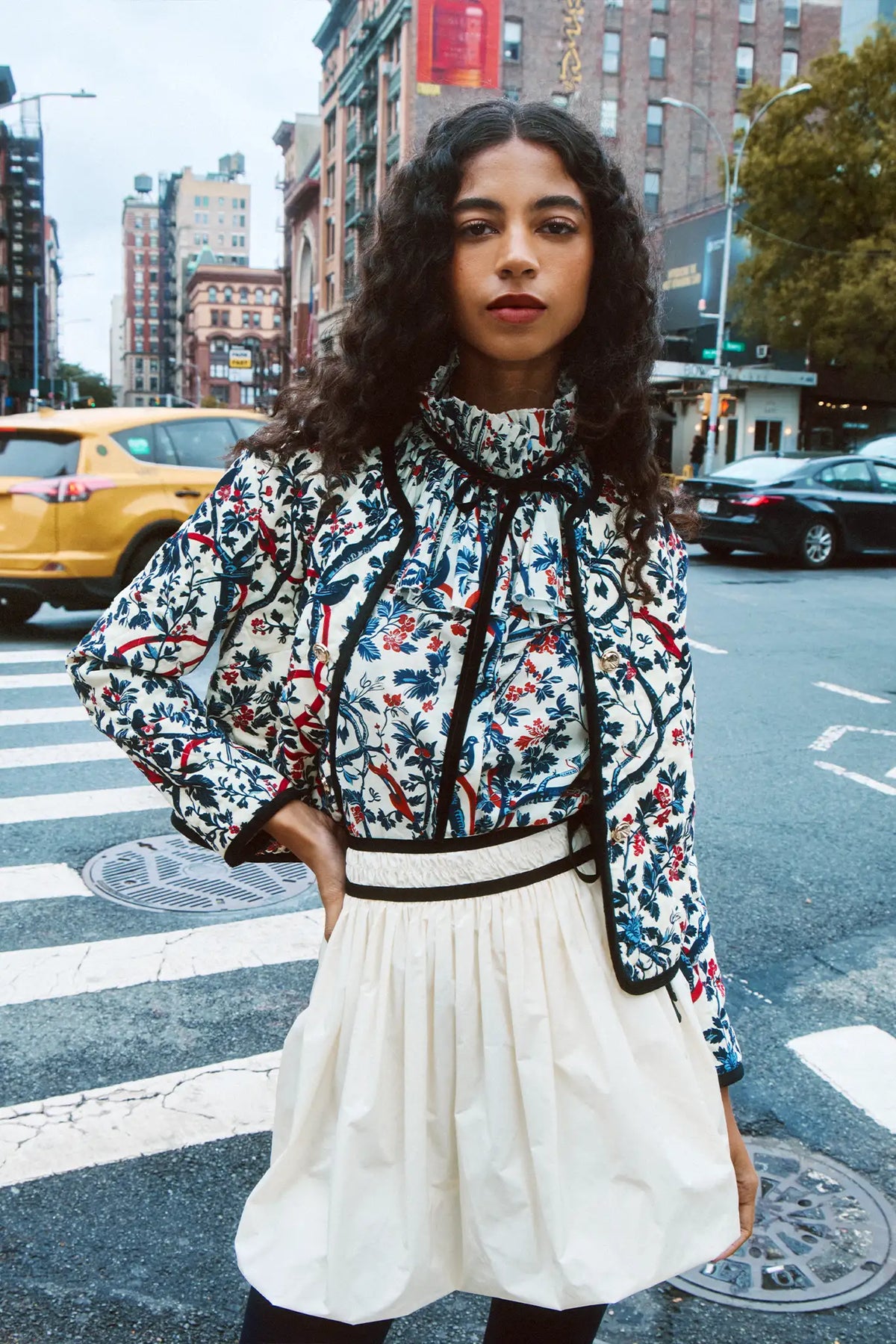 The Angelina Skirt is the bubble mini in ivory taffeta with velvet ribbon detailing.