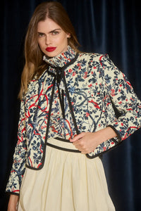 The Atwood Jacket is a quilted jacket with a crew neckline, long sleeves, and velvet ribbon trim.