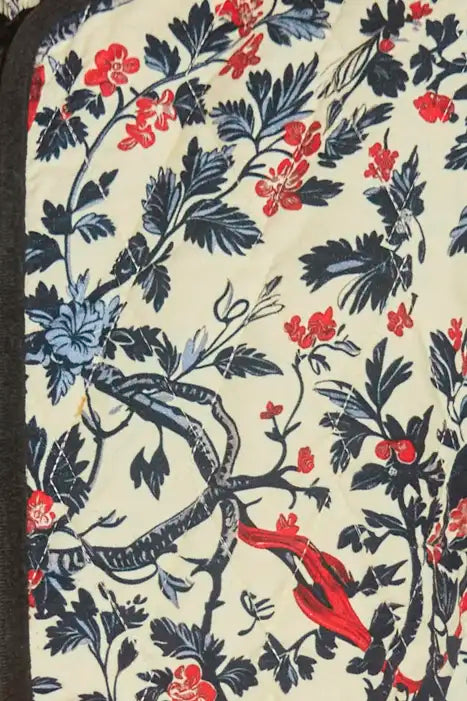 The Atwood Jacket is a quilted jacket with a crew neckline, long sleeves, and velvet ribbon trim.