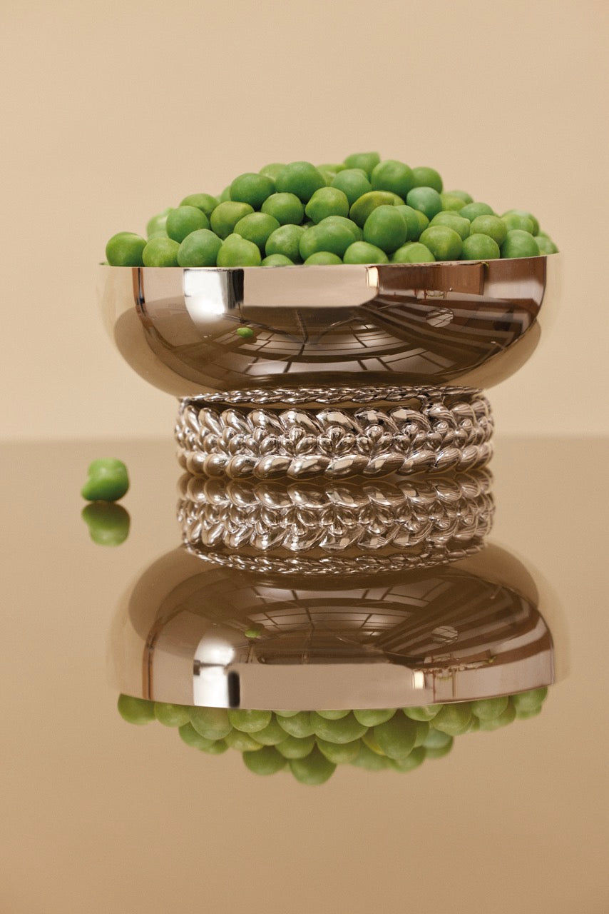 Front view of Babylone Silver-plated Small Bowl showcasing its braided base with green fruit on a reflective surface