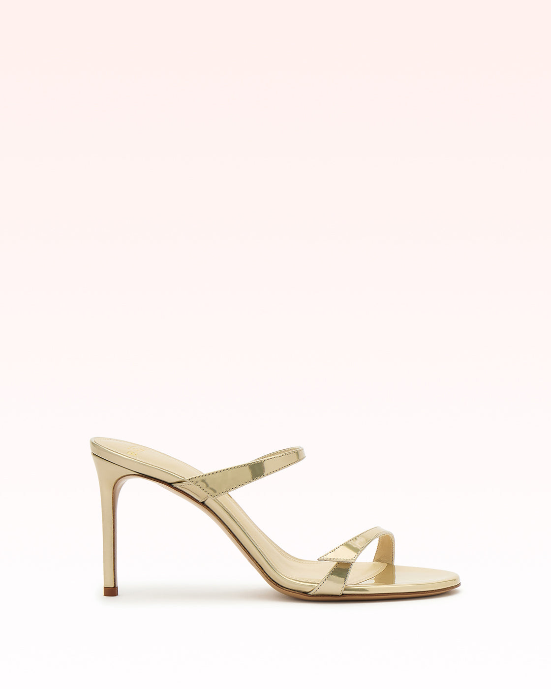 Side view of Tita Sandal 85 in yellow with slim double straps, 3.3-inch stiletto heel and glossy leather on pale background