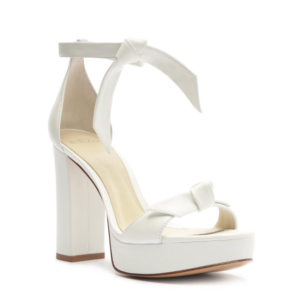 Front three-quarter view of Mabeleh White Platform showcasing Claritas bow upper, platform, and block heel on white background