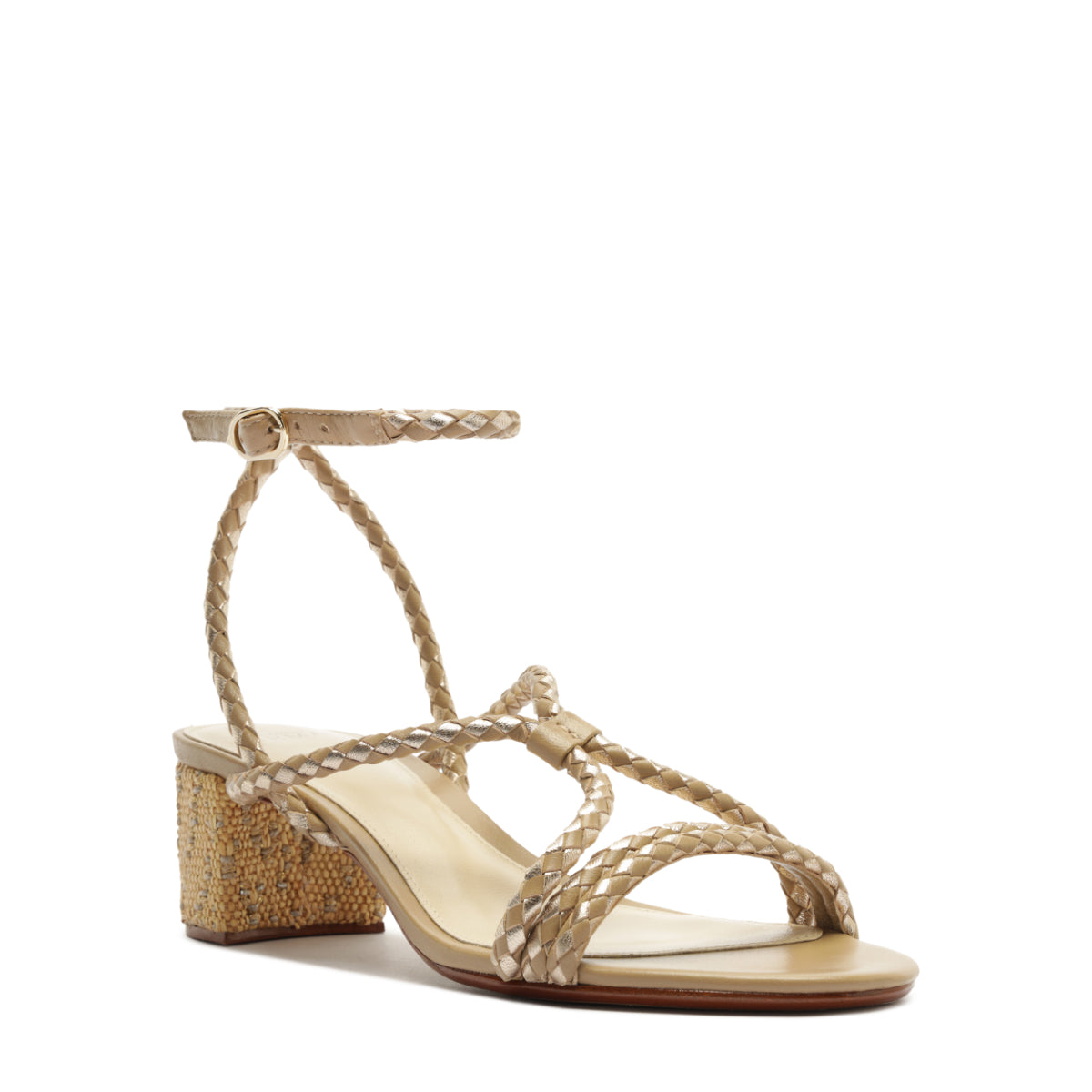 Three-quarter view of Elba 45 sandal in semolina showcasing braided leather straps, ankle buckle and raffia-wrapped block heel on white background