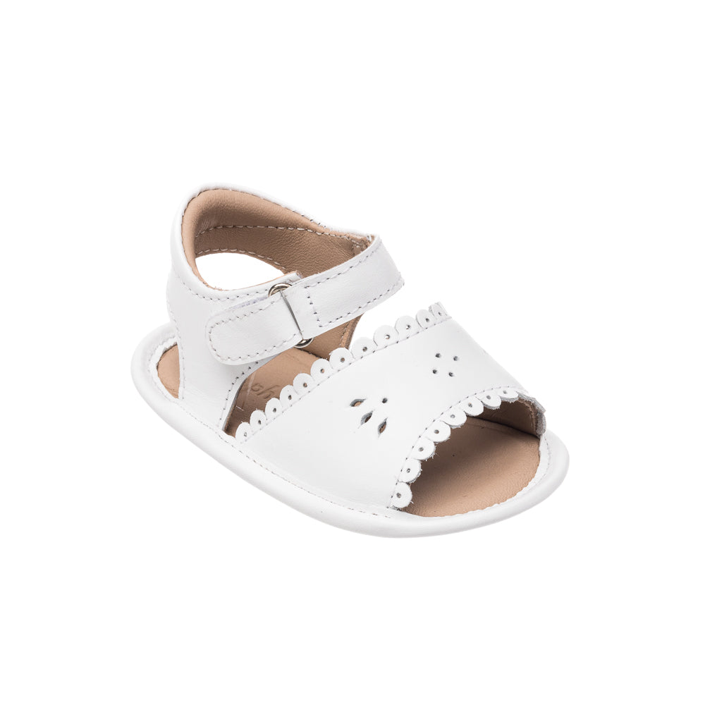 Three-quarter view of Sandal with Scallop White showcasing scalloped trim and supportive ankle strap with a white background