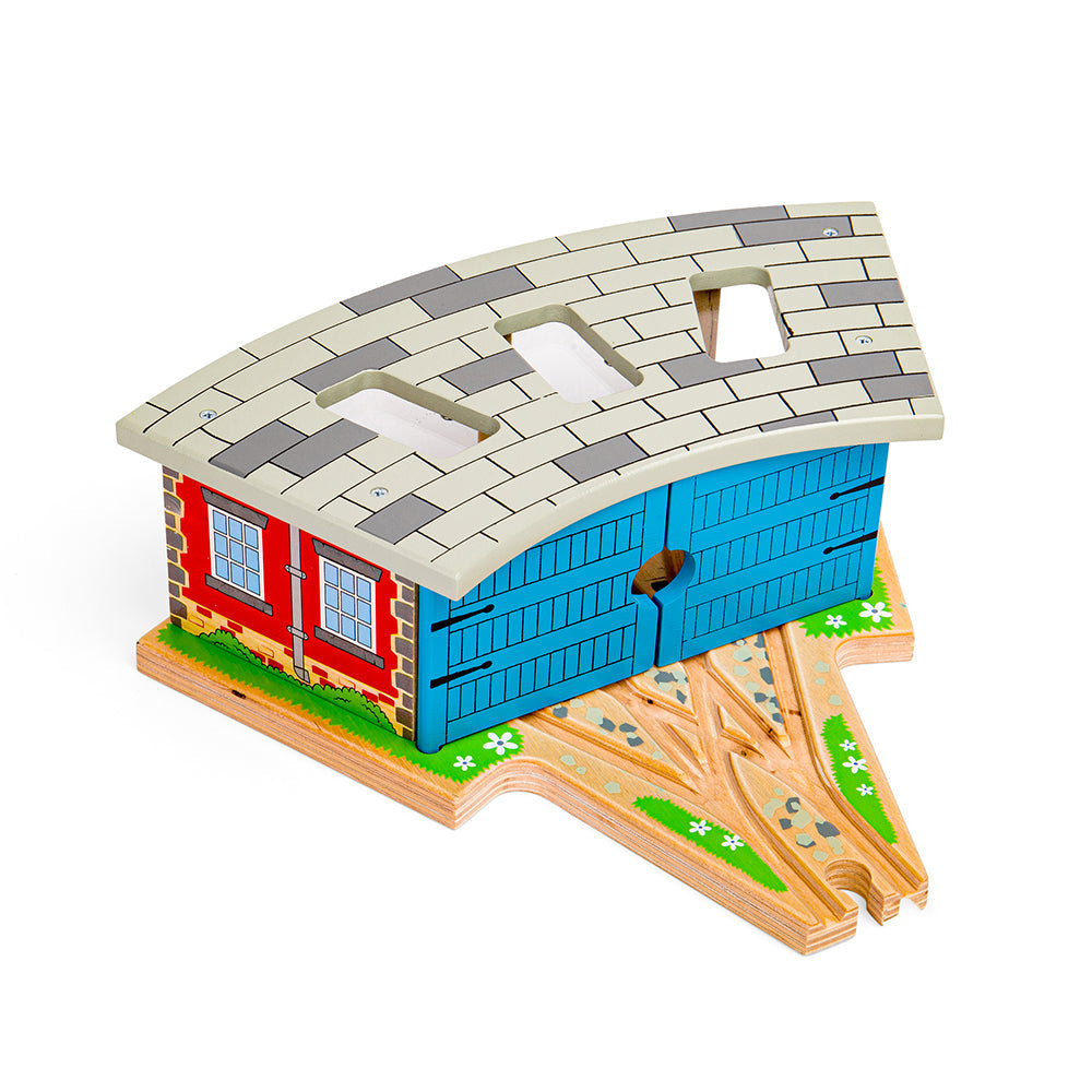 Angled top view of Triple Engine Shed with blue doors, curved tiled roof with three cut-outs and wooden track base