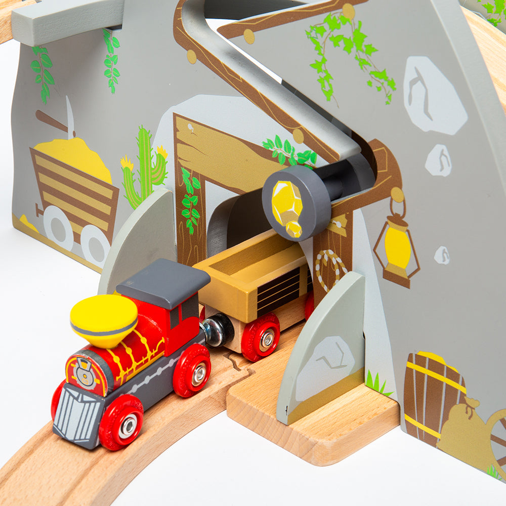 Close-up of Wild West Train Set showcasing the train engine, gold mine tunnel, and golden nugget track on wooden rails