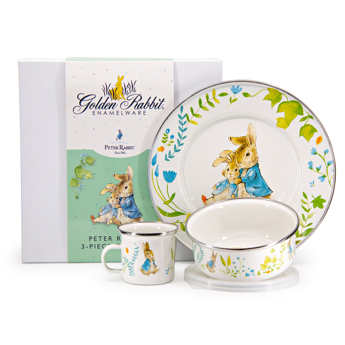 Front view of Child Set in Spring Leaves showcasing Peter Rabbit illustrations on a mug, bowl, and plate with packaging behind