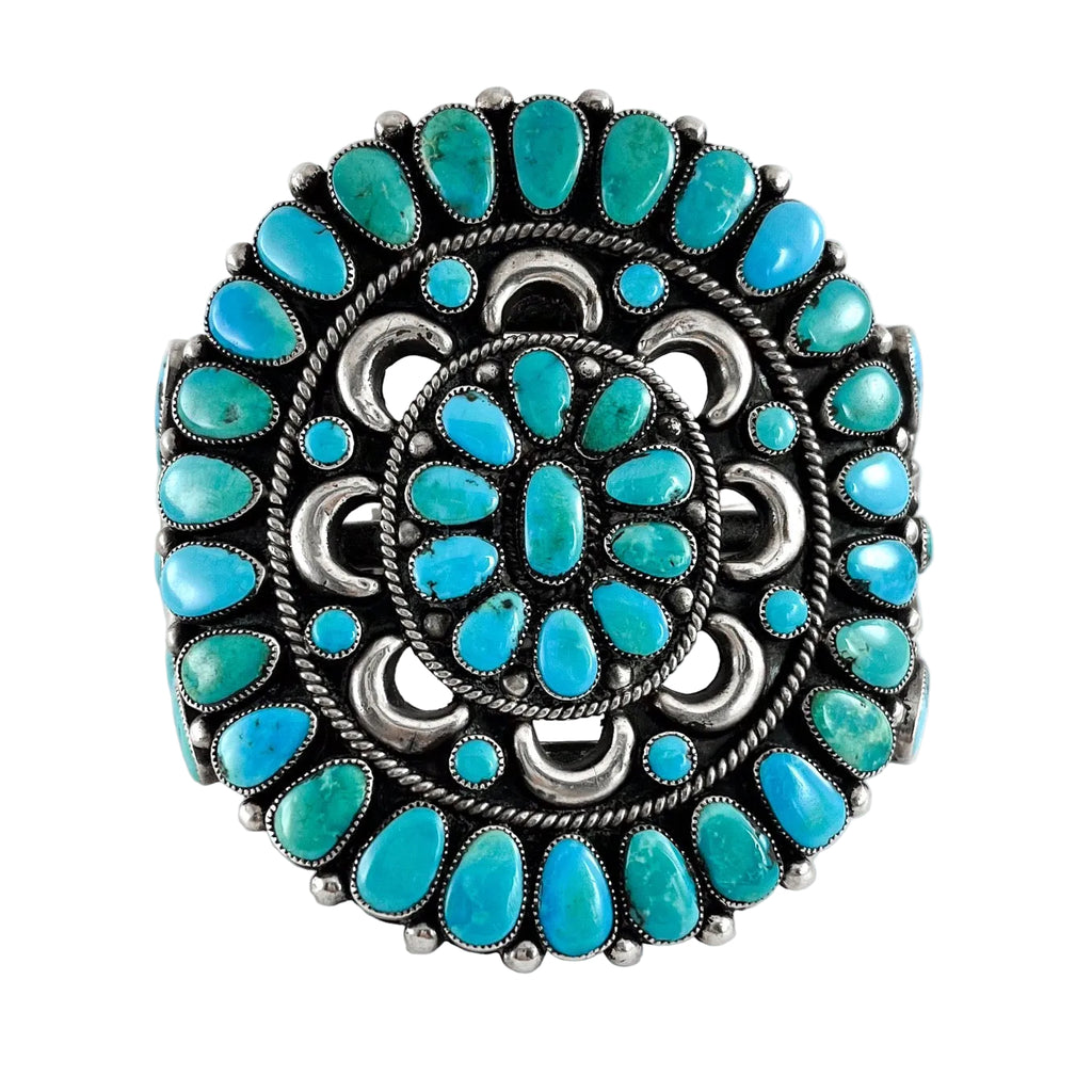 Front view of Vintage Zuni Cluster Bracelet showcasing natural American turquoise stones set in sterling silver with a white background
