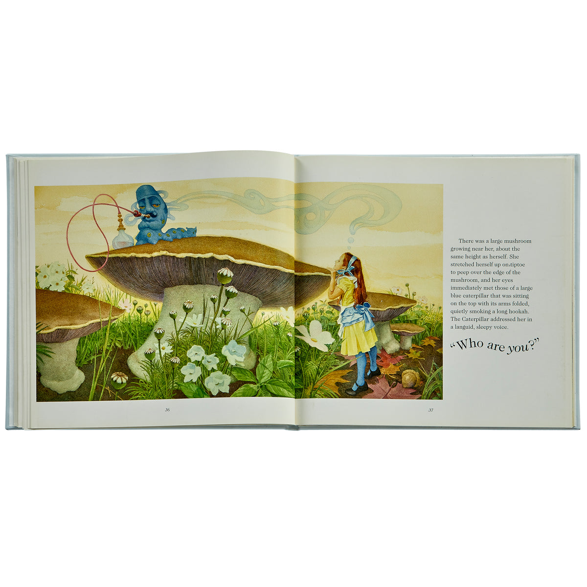 Open spread of Alice’s Adventures bonded leather book showing Alice with a blue caterpillar on a mushroom with text Who are you?