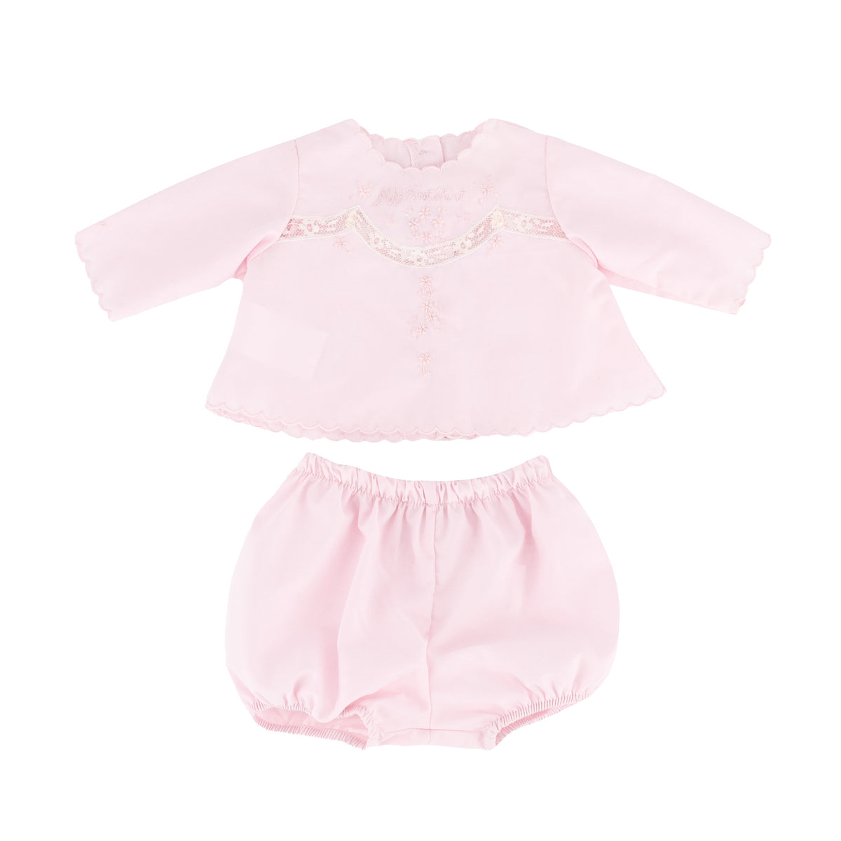 Top view of Baby’s First shirt and bloomers in pink with scalloped neckline, hand embroidery and lace trim on white