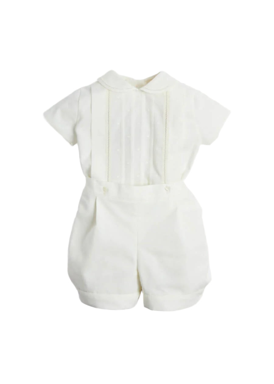 Front view of ivory baby two-piece set with Peter Pan collar, short sleeves, embroidered dotted front panel and buttoned coordinating shorts on white background