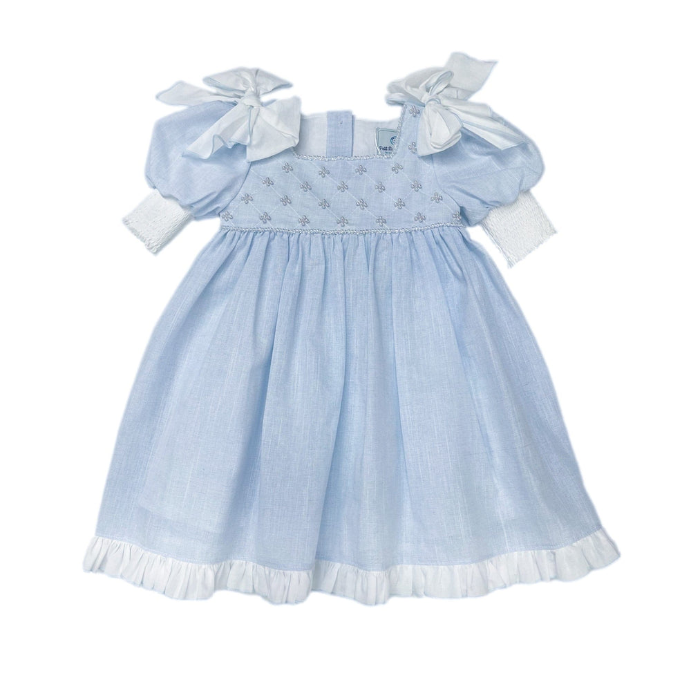 Baby blue linen girls dress with faux pearl hand beading, white shoulder bows, empire waist, puff sleeves, and large back tie bow.