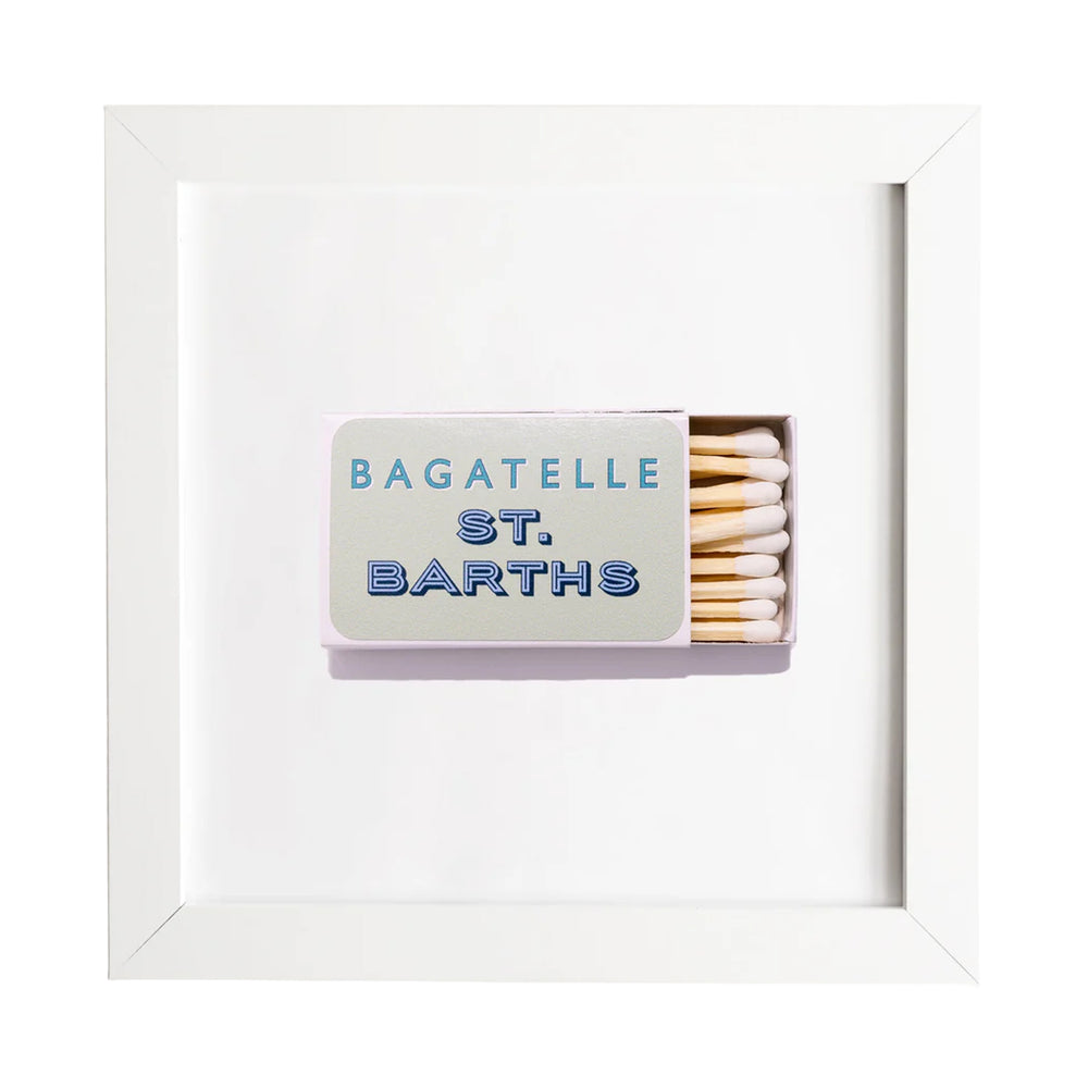 Front view of Bagatelle St. Barths framed matchbook print showing open matchbox labeled BAGATELLE ST. BARTHS in a white frame on white background