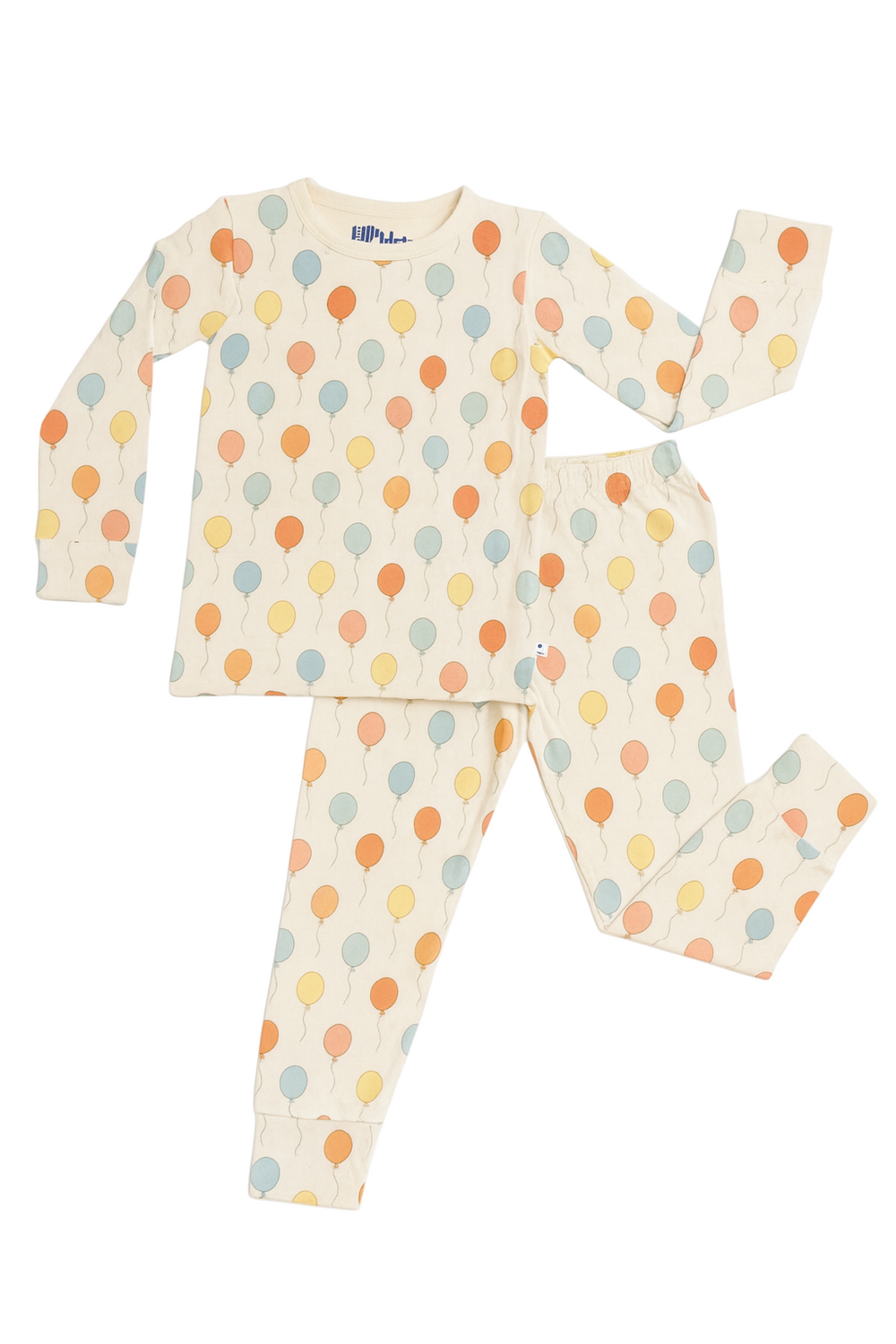 Flat lay of kids balloon bamboo pajama set with long-sleeve top and pants in pastel balloon print on white background