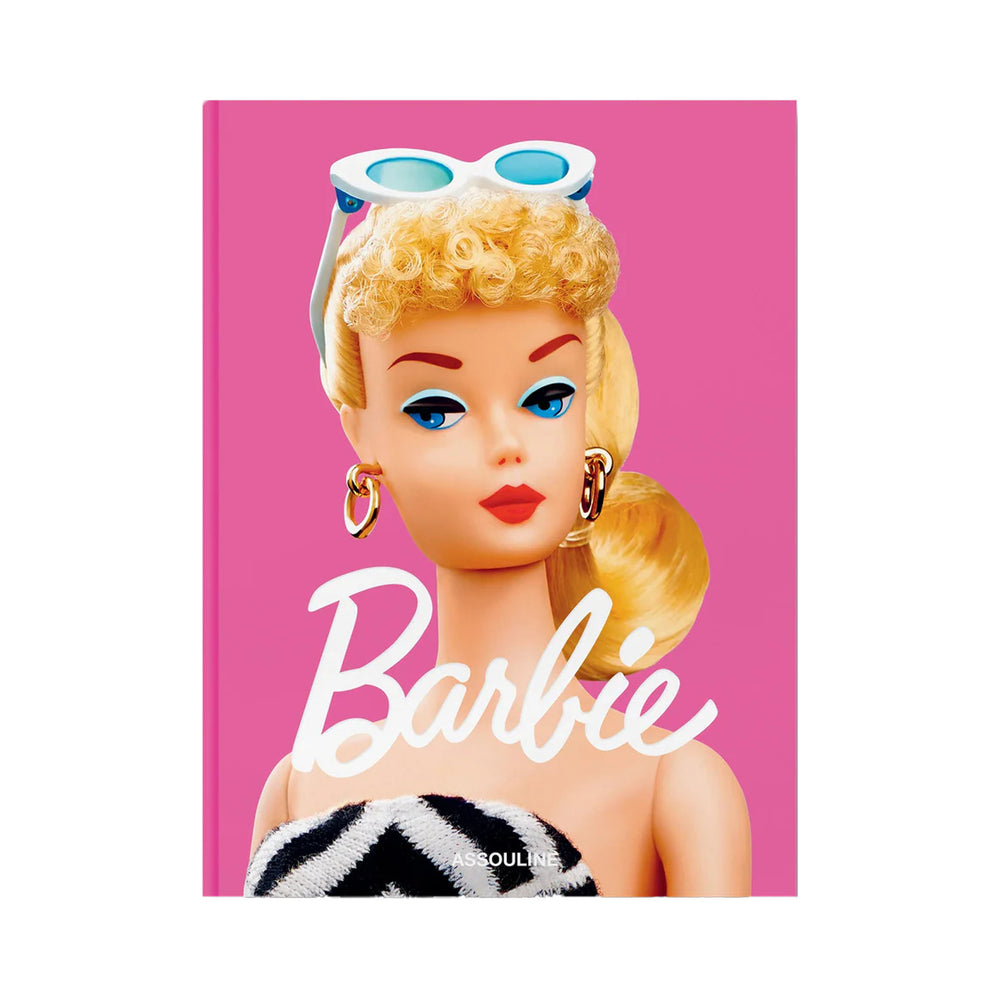 Front cover of Barbie hardcover book showing close-up of vintage Barbie doll head on pink background with large white Barbie title