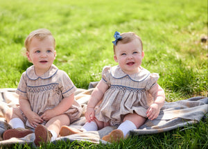 Little English classic children's clothing.  Smocked peter pan bubble in tan and blue Durham windowpane with blue piping for baby boys