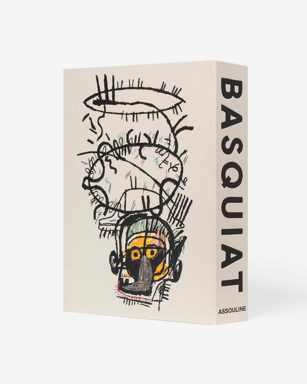 Basquiat: The World of Jean-Michel by Assouline: alternate angle showing a second Basquiat artwork on the cover — an expressive neo-expressionist portrait with a yellow-skinned skull-like face, frenetic gestural black marks, and abstracted features in Basquiat's raw signature style; BASQUIAT on the spine at right