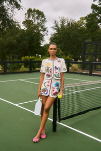 The Beeson Top is a crew neckline and elbow-length sleeves, non-fitted bodice with colorful detail