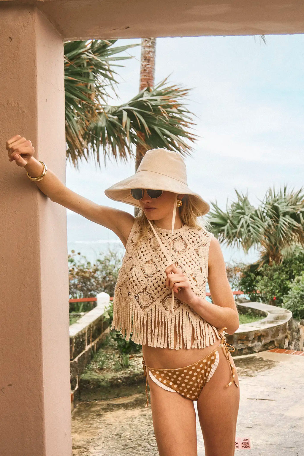 The Belize Bikini Bottom in coconut sand dot paired with cream fringe Astor Top and bucket hat.