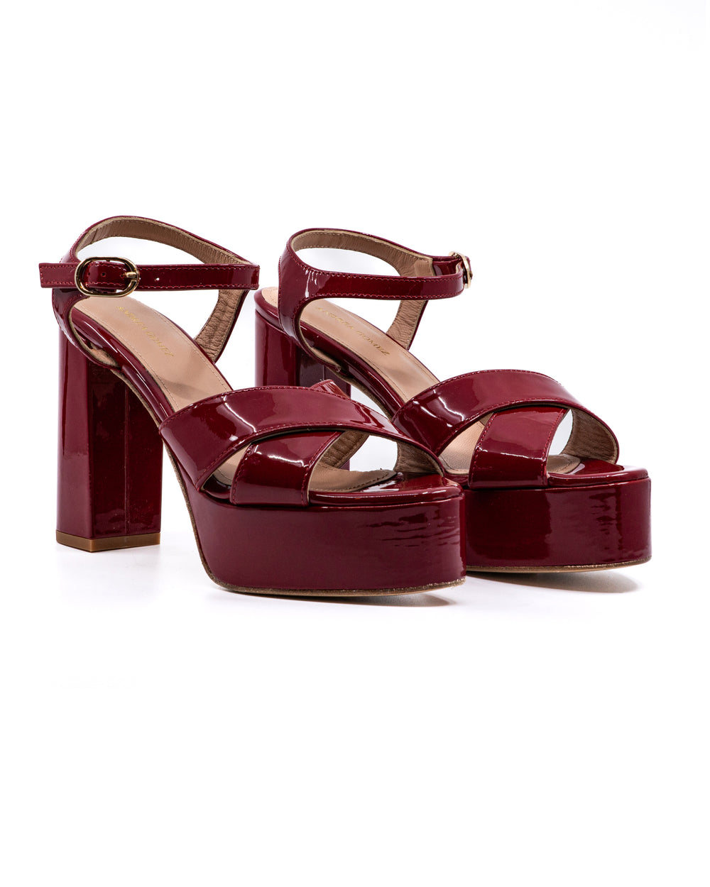 Three-quarter view of Bella Patent Platform in red showcasing patent leather platform and block heel on white background