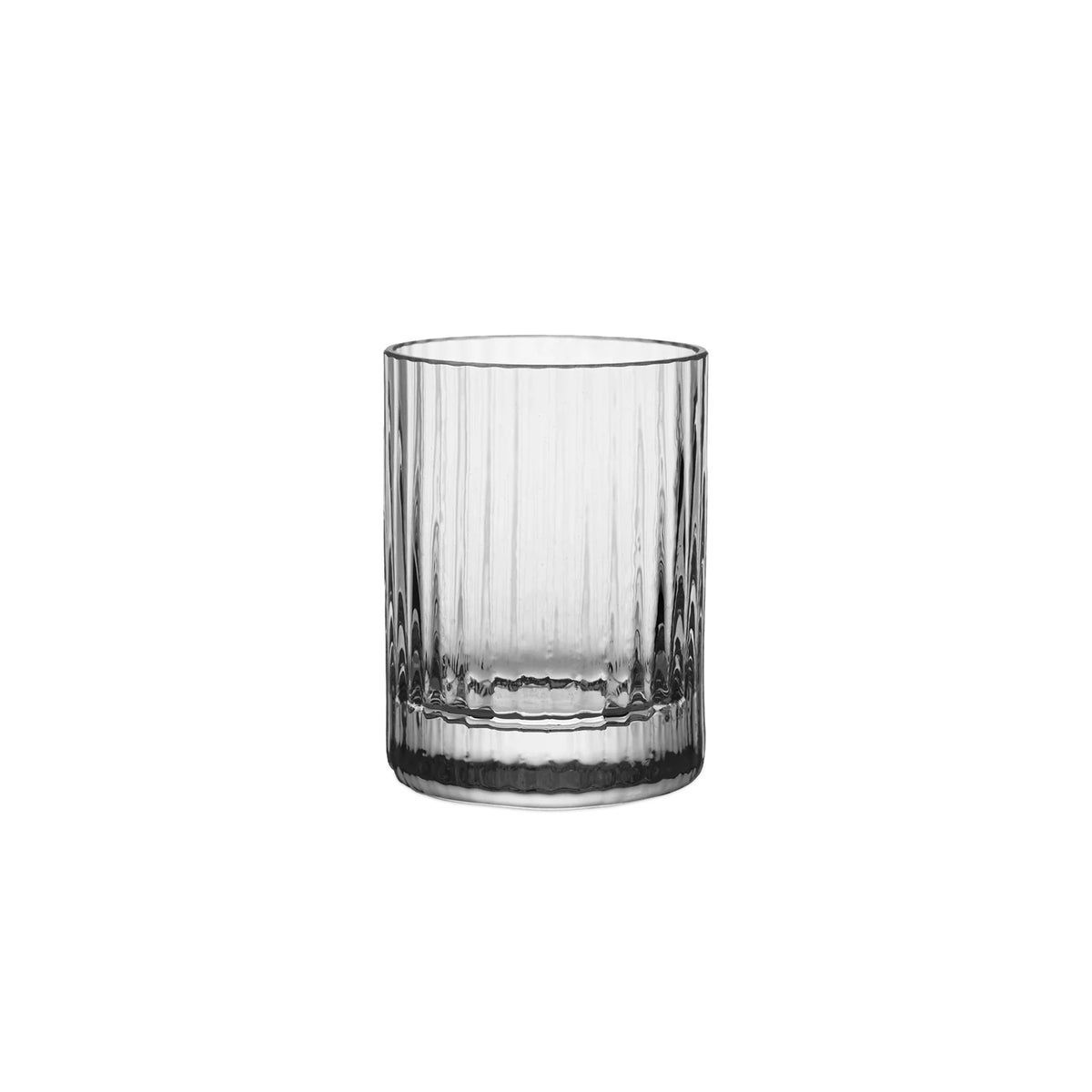 Front view of the Bembo Shot Glass, Pleat showcasing clear pleated sides and a heavy base on a white background
