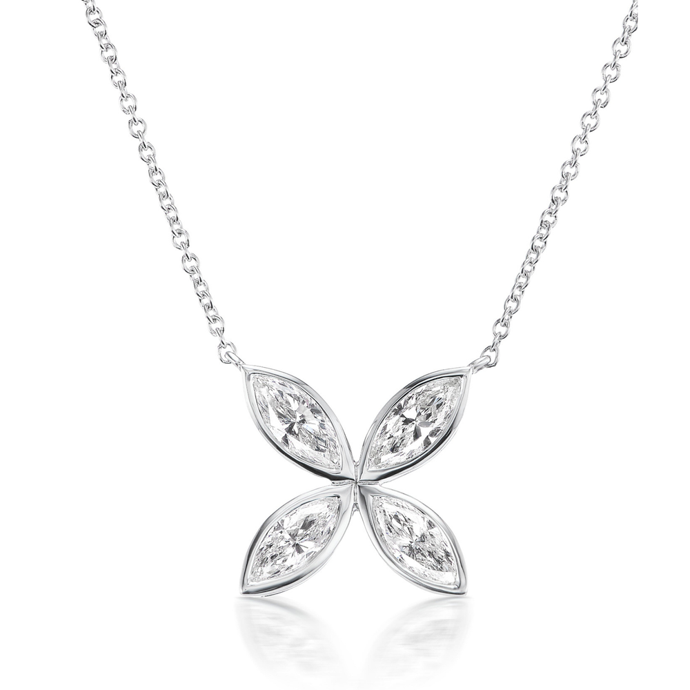 The Bezel Set Marquise Diamond Floral Pendant is a silver necklace with a four-petal flower pendant, each petal set with marquise diamonds. Displayed on a white background, the 18-inch chain ensures a perfect fit.