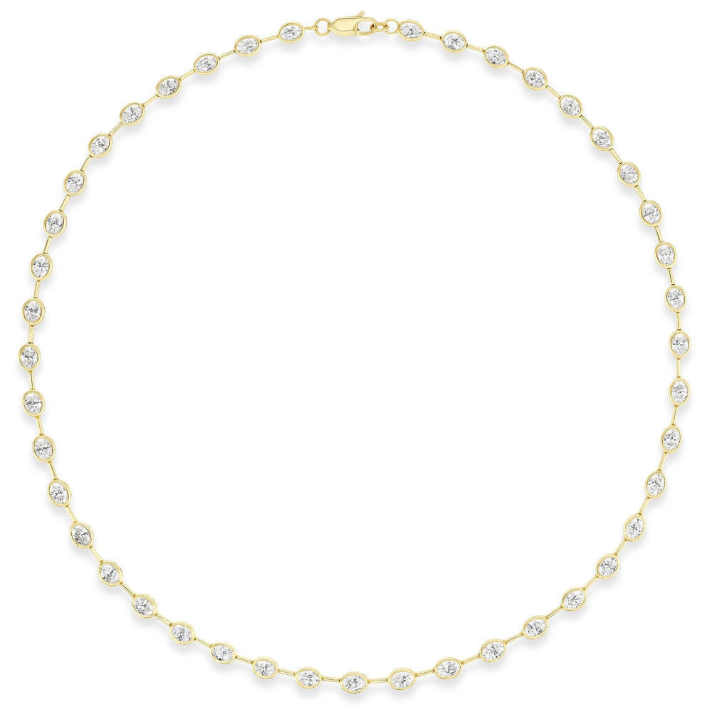 The Bezel Set Oval Diamond Necklace in Yellow Gold features evenly spaced oval diamonds, each set in a bezel of 18k yellow gold, arranged in a circle against a white background.