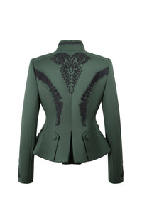 Back view of Blaire Vert in Green showcasing hand-embroidered black silk detailing on a white background