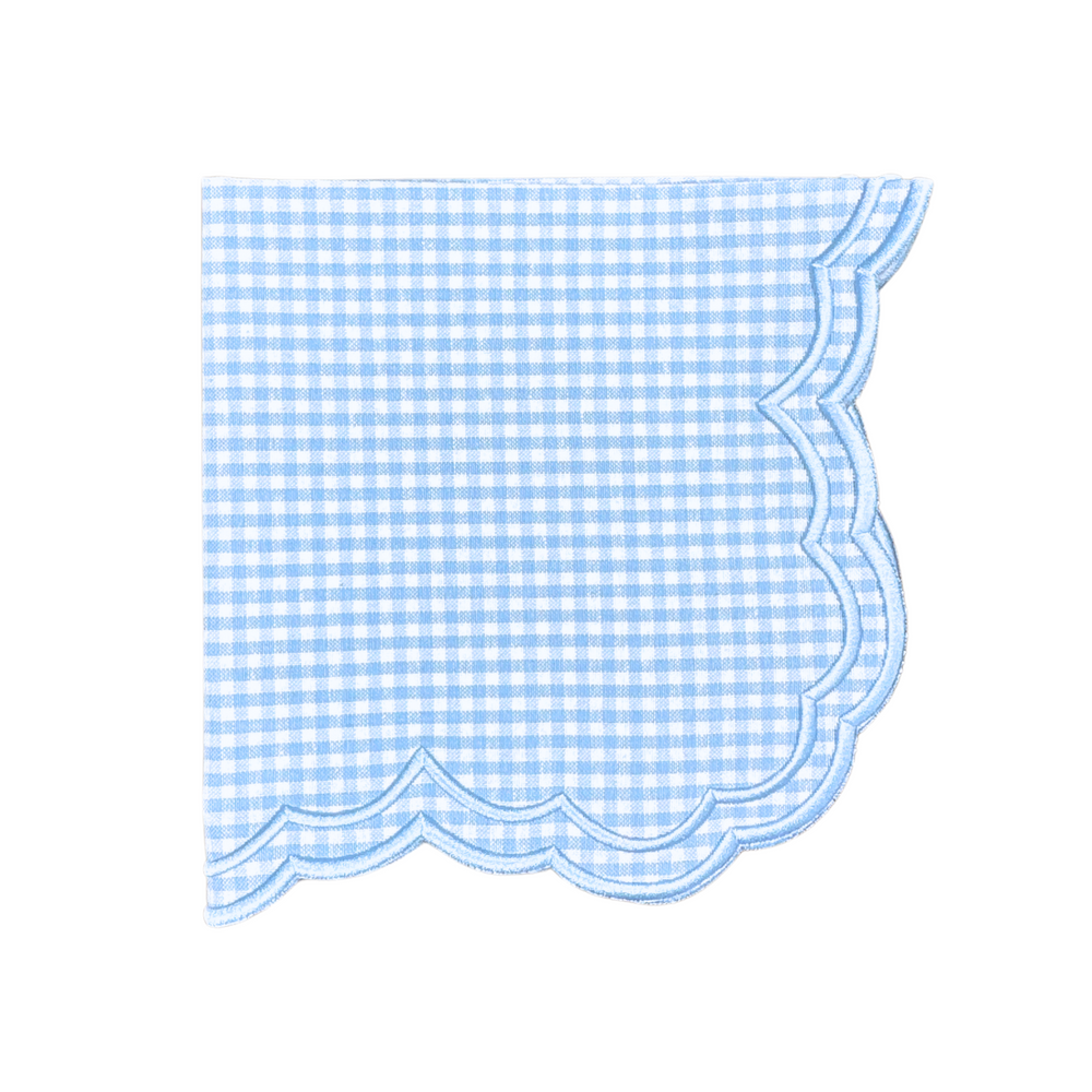 Top view of Bettina-Gingham Napkin in Blue, Set of 4 showcasing blue gingham pattern and white embroidered trim on white background