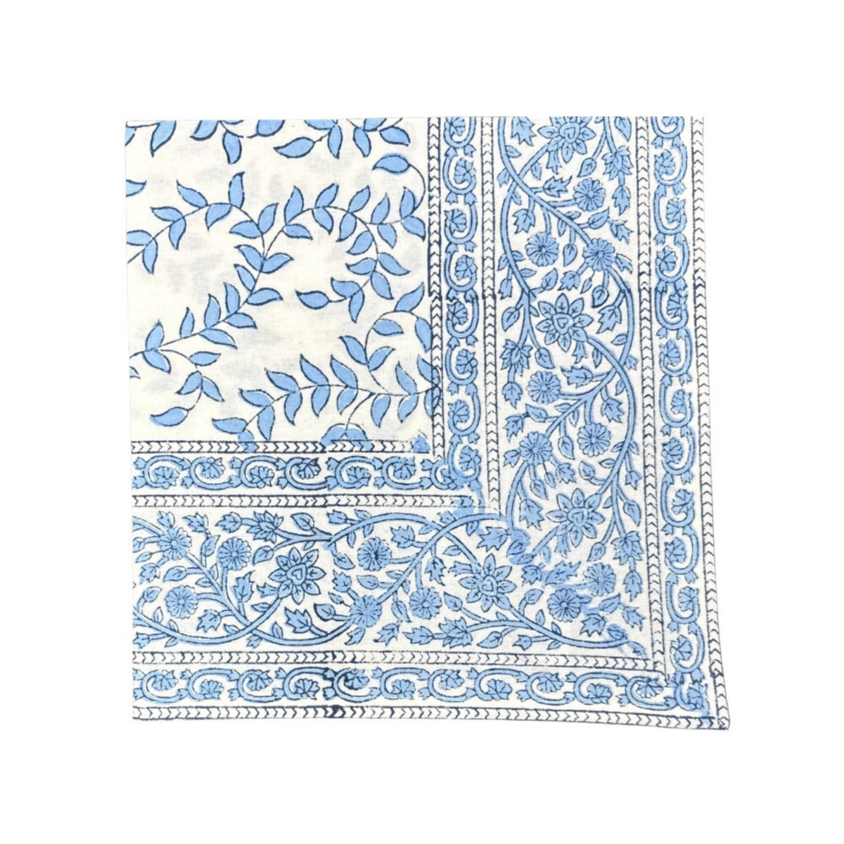 Close-up of Blue Leaves napkin showcasing blue block-printed leaf motif and floral border on white cotton