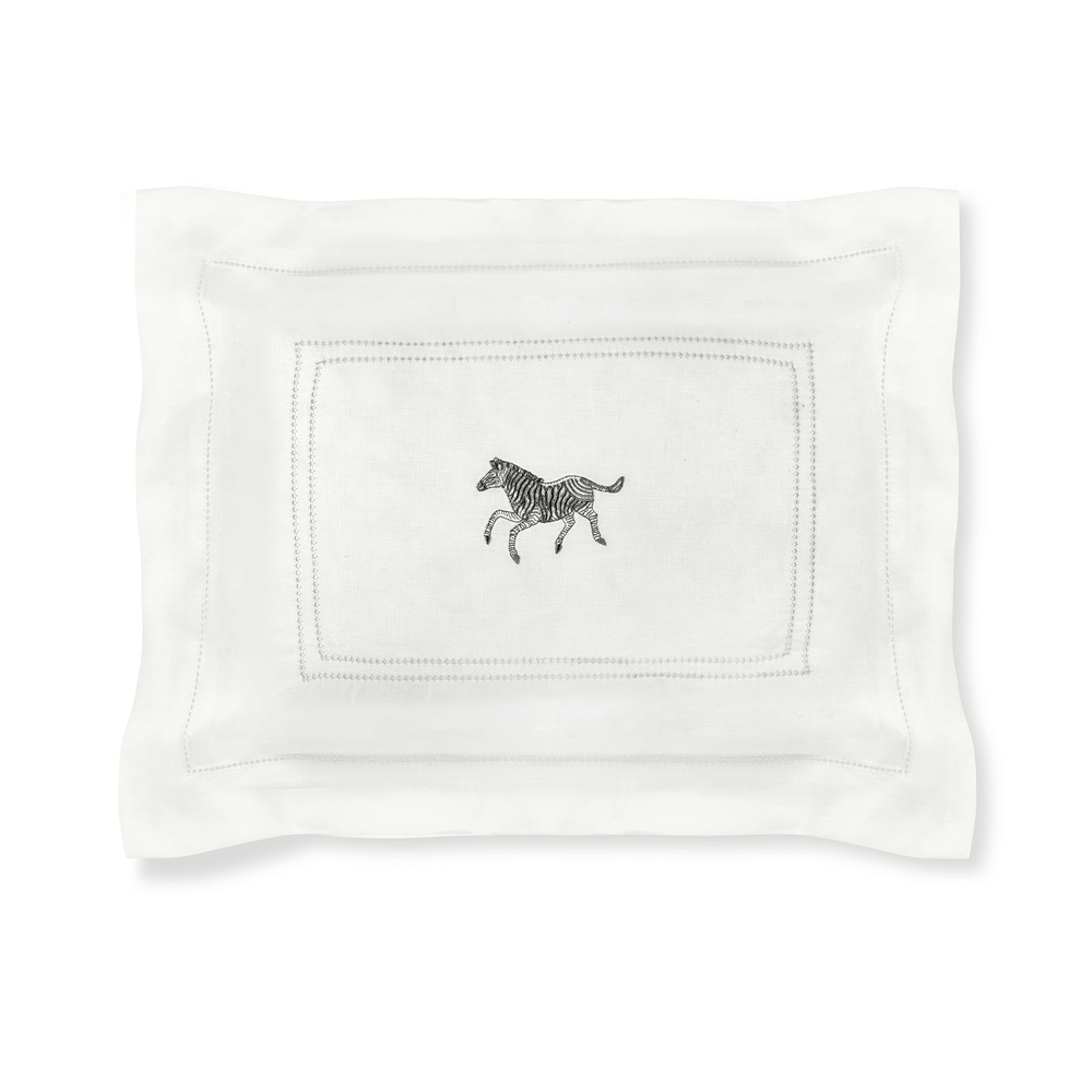 Front view of the boudoir pillow showcasing Parma Grey hemstitch border and zebra embroidery on a white background