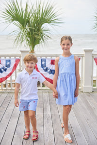 Little English traditional children's clothing.  Blue gingham shorts with all-over American flag embroidery for boys.  Boy's shorts for 4th of July.