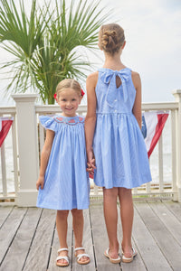 Little English traditional children's clothing.  Royal blue mini gingham sleeveless dress with white ricrac trim and bow tie in back for little girls